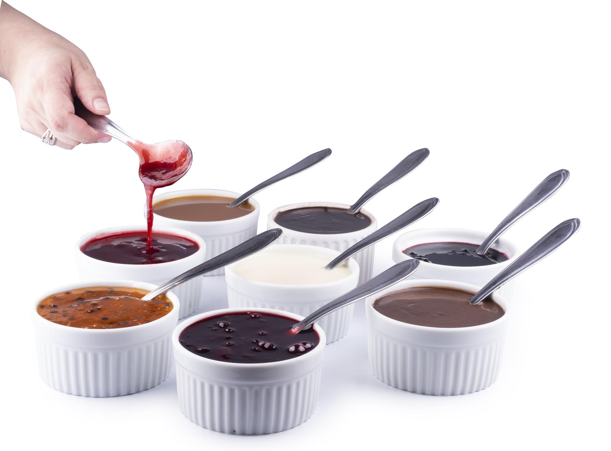 Group around a bench tasting a sauce